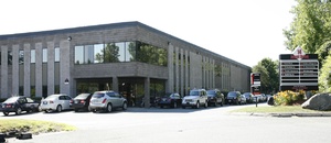 A parking lot of a industrial space leased by Howland Development in Wilmington, MA